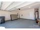A well-lit two-car garage with clean walls, epoxy flooring, and ample space for parking and storage solutions at 4312 Plumeria Way, Fort Mill, SC 29707