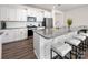 Modern kitchen featuring an island with barstool seating and stainless steel appliances at 4312 Plumeria Way, Fort Mill, SC 29707