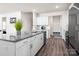 Open kitchen featuring a large island with granite countertops, white cabinets, and stainless steel appliances at 4312 Plumeria Way, Fort Mill, SC 29707