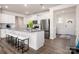 Spacious kitchen with white cabinets, granite counters, an island, stainless appliances, and an open design at 4312 Plumeria Way, Fort Mill, SC 29707