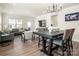 The spacious living room and dining area create a welcoming atmosphere with modern lighting and stylish furniture at 4312 Plumeria Way, Fort Mill, SC 29707