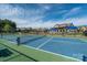 Well maintained community tennis courts with a glimpse of the pool house and blue skies at 4312 Plumeria Way, Fort Mill, SC 29707