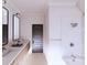 Modern bathroom featuring a double vanity, sleek fixtures, and a combined shower and tub at 4609 Firethorn Ct, Denver, NC 28037