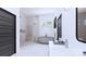 Modern bathroom with a frameless glass shower, soaking tub, and sleek white vanity at 4609 Firethorn Ct, Denver, NC 28037