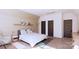 Comfortable bedroom featuring a plush bed, a seating area, and ample natural light from the large window at 4609 Firethorn Ct, Denver, NC 28037