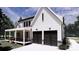 Charming home exterior highlighting a two-car garage and covered porch at 4609 Firethorn Ct, Denver, NC 28037