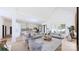 Open floor plan connects living room and kitchen with hardwood floors and abundant natural light at 4609 Firethorn Ct, Denver, NC 28037