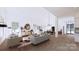 Spacious open living room featuring hardwood floors, recessed lighting, and views of the outside at 4609 Firethorn Ct, Denver, NC 28037