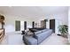 Spacious living room with a large sectional sofa, modern lighting, and access to the outdoors at 4609 Firethorn Ct, Denver, NC 28037