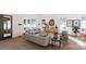 Cozy living area with hardwood floors, stylish furnishings and large windows overlooking the yard at 4609 Firethorn Ct, Denver, NC 28037