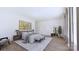 Bright bedroom featuring hardwood floors, stylish decor, and large windows for natural light at 4609 Firethorn Ct, Denver, NC 28037