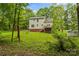 Lush backyard with a deck and playground, perfect for outdoor enjoyment at 4927 Gateway Dr, Claremont, NC 28610