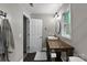 Bathroom boasts a wood vanity, vessel sink, window, and tile floors at 4927 Gateway Dr, Claremont, NC 28610