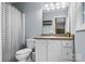 Cozy bathroom featuring a shower with tub and vanity with mirror at 4927 Gateway Dr, Claremont, NC 28610