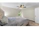 Neutral bedroom with large comfortable bed, window, and ceiling fan with lights at 4927 Gateway Dr, Claremont, NC 28610