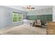 bedroom featuring a bed, a chair, and a window with natural light at 4927 Gateway Dr, Claremont, NC 28610