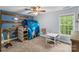 Stylish bedroom featuring a play structure, a desk, and a bed at 4927 Gateway Dr, Claremont, NC 28610