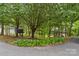 Charming front yard featuring a variety of plants and a driveway leading to the property at 4927 Gateway Dr, Claremont, NC 28610