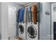 Functional laundry room with a washer, dryer and hanging rack at 4927 Gateway Dr, Claremont, NC 28610