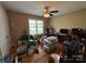 Bedroom featuring hardwood floors, a ceiling fan, and a bright window view at 506 E Pine St, Maiden, NC 28650