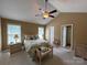 Serene bedroom with vaulted ceiling, carpeted floors, and coordinated furniture at 506 E Pine St, Maiden, NC 28650