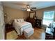 Comfortable bedroom with hardwood floors, ceiling fan, and natural light at 506 E Pine St, Maiden, NC 28650