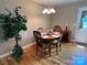 Cozy dining room with hardwood floors, natural light, and decorative chandelier at 506 E Pine St, Maiden, NC 28650