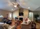Spacious living room featuring hardwood floors, a fireplace, and comfortable seating at 506 E Pine St, Maiden, NC 28650