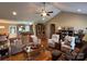 Inviting living room featuring a ceiling fan, hardwood floors, and vaulted ceiling at 506 E Pine St, Maiden, NC 28650