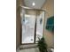 Glass-enclosed shower stall featuring tiled walls and showerhead at 506 E Pine St, Maiden, NC 28650