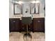 Bathroom featuring dual vanities, mirrors, and a stool at 548 Alspaugh Dam Rd, Taylorsville, NC 28681