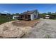 This home showcases its metal roof, landscaping, outbuildings and ample parking at 548 Alspaugh Dam Rd, Taylorsville, NC 28681