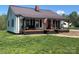 View of this home showcasing its quaint charm, covered front porch, and landscaping at 548 Alspaugh Dam Rd, Taylorsville, NC 28681