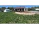 Charming home with a metal roof, covered front porch, and well manicured yard at 548 Alspaugh Dam Rd, Taylorsville, NC 28681
