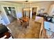 Cozy kitchen with a wooden dining table and modern lighting fixtures at 548 Alspaugh Dam Rd, Taylorsville, NC 28681