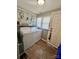 Functional laundry room with a washer, dryer, and natural light from the window at 548 Alspaugh Dam Rd, Taylorsville, NC 28681