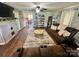 Spacious living room with cozy seating, a decorative rug, and an open view to the kitchen at 548 Alspaugh Dam Rd, Taylorsville, NC 28681