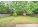 Backyard features mature trees and a storage shed at 6007 Kenmore Ln, Indian Trail, NC 28079