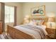 Charming bedroom with a comfortable bed, soft lighting, and a bright window perfect for relaxing at 6007 Kenmore Ln, Indian Trail, NC 28079