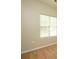 Bedroom features neutral paint and carpet; window with blinds allows natural light at 6007 Kenmore Ln, Indian Trail, NC 28079