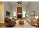 A bright living room featuring a fireplace and neutral decor, creating an inviting and cozy atmosphere at 6007 Kenmore Ln, Indian Trail, NC 28079