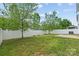Large backyard featuring a fenced perimeter, well-kept grass and a concrete patio at 6041 Laurent Ave, Fort Mill, SC 29715