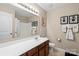 Neutral bathroom featuring a vanity, framed art, and decorative monogrammed towels at 6041 Laurent Ave, Fort Mill, SC 29715