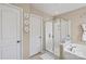 This well-lit bathroom features a glass shower, white cabinets, and decorative elements at 6041 Laurent Ave, Fort Mill, SC 29715