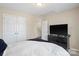 Bedroom with a double closet, dresser with television, and neutral paint at 6041 Laurent Ave, Fort Mill, SC 29715