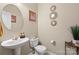 Compact half-bathroom featuring modern fixtures, decorative mirror and neutral wall colors at 6041 Laurent Ave, Fort Mill, SC 29715
