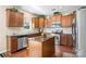 This kitchen features granite countertops, stainless steel appliances and a central island at 6041 Laurent Ave, Fort Mill, SC 29715