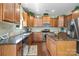 This kitchen features granite countertops, stainless steel appliances and a central island at 6041 Laurent Ave, Fort Mill, SC 29715