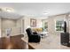 Bright living room with hardwood floors, recessed lights, and neutral color scheme at 6041 Laurent Ave, Fort Mill, SC 29715