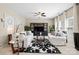 Living room with natural light and featuring stylish black and white patterned decor and neutral walls at 6041 Laurent Ave, Fort Mill, SC 29715